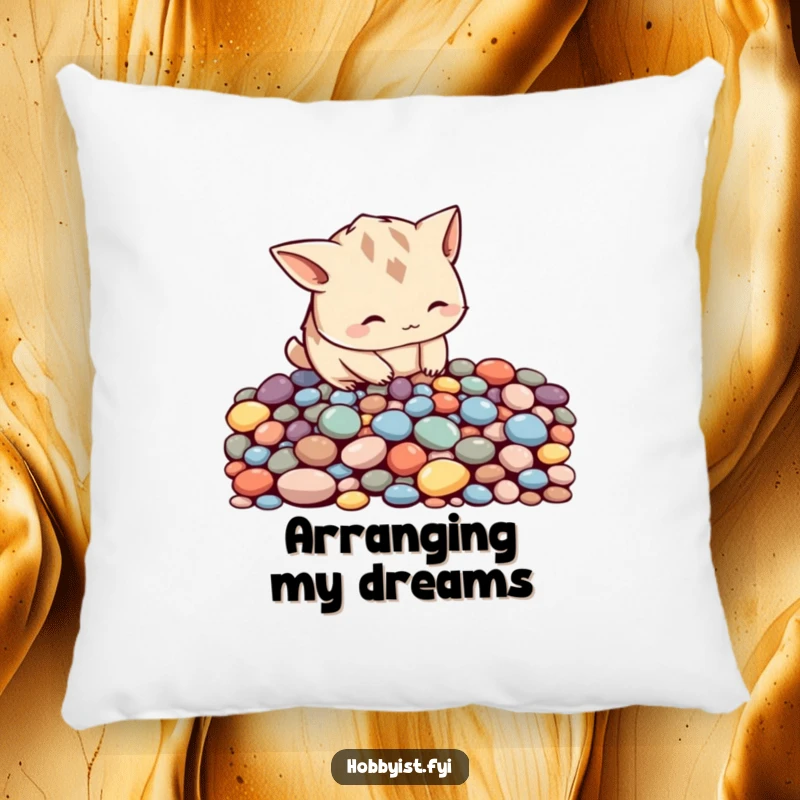 Funny curious creature with pointy ears meticulously arranging colorful pebbles into a pattern, on a soft pillow for cozy mindful vibes.