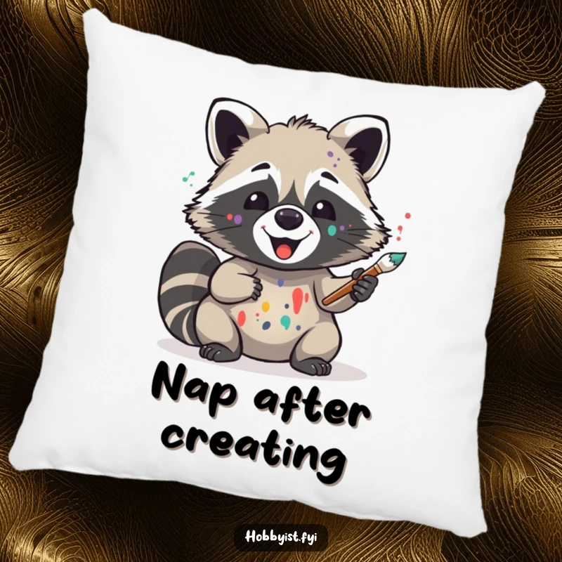 Funny decorative pillow featuring a delighted raccoon artist with paint splatters, holding a brush, adding comfort and humor to sofas and beds.