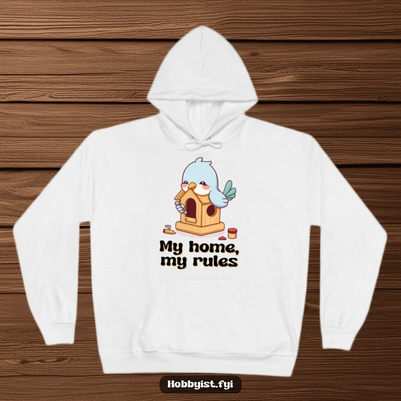 Funny Bird Building Hoodie: A playful bird enthusiastically builds a miniature birdhouse with tiny tools, making for cozy, humorous construction.