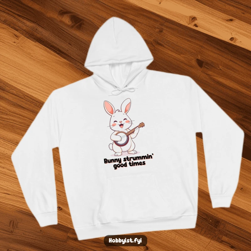 Funny hoodie depicting a cheerful bunny enthusiastically playing a miniature banjo, radiating a fun, musical vibe.