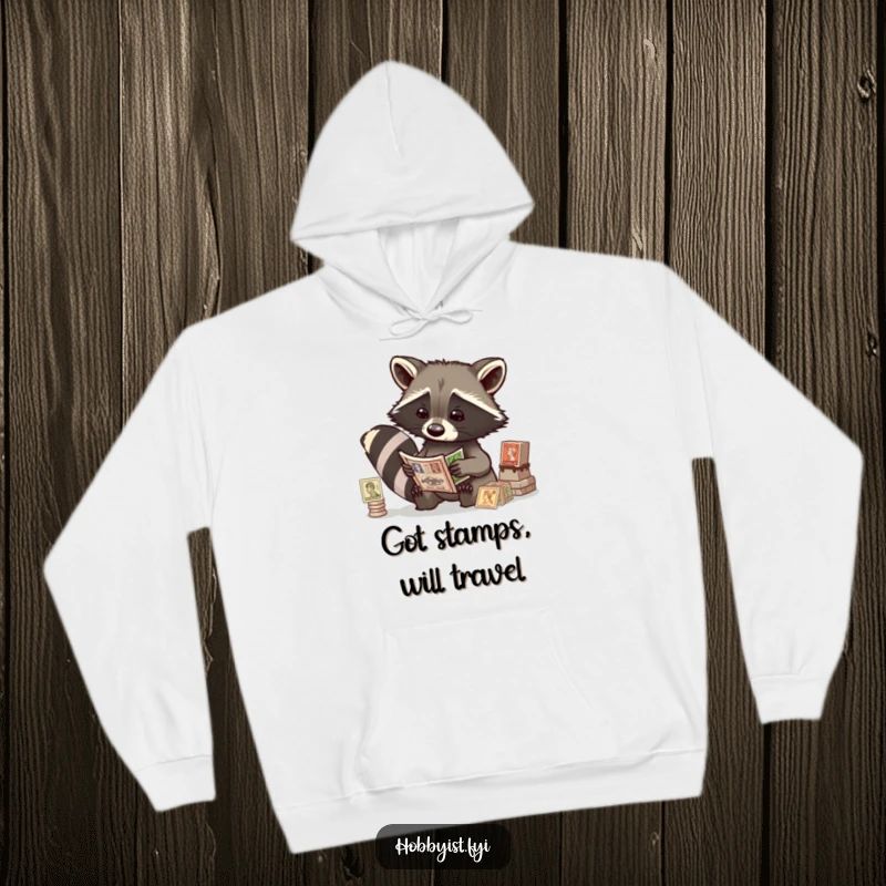 Funny raccoon intently studying antique stamps, depicted on a soft hooded sweatshirt, ideal for collectors and animal lovers.