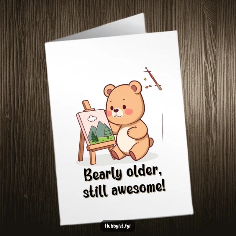 Funny Free Printable Birthday Card: A cute bear artist happily painting a tiny landscape on a small canvas, wearing a party hat.