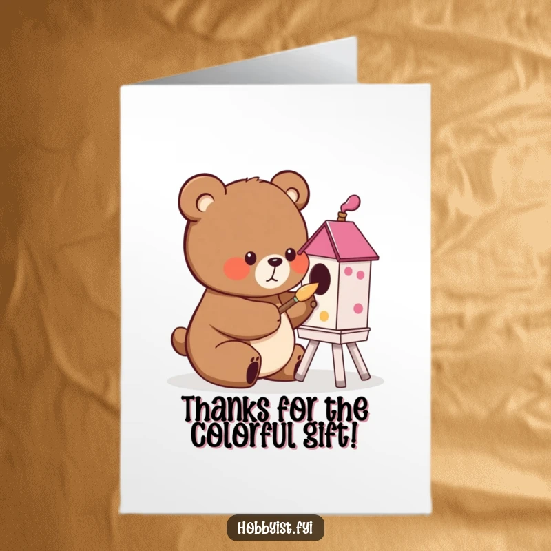 Funny free printable thank you card of a cute bear character concentrating on painting a colorful birdhouse with a tiny brush.