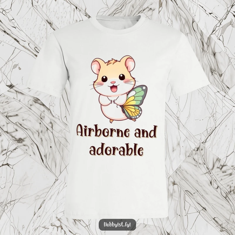 Funny T-Shirt: A joyful hamster takes flight, riding a miniature butterfly with sheer happiness, illustrating a whimsical and delightful adventure.