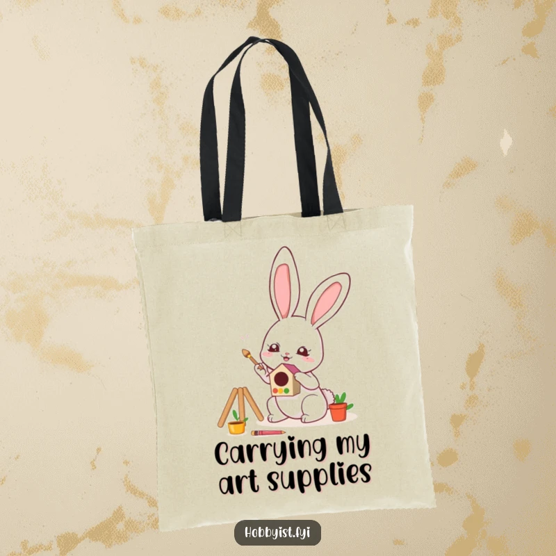 Funny Tote Bag showcasing a cute kawaii bunny enthusiastically painting a tiny, colorful birdhouse, ideal for carrying art essentials.